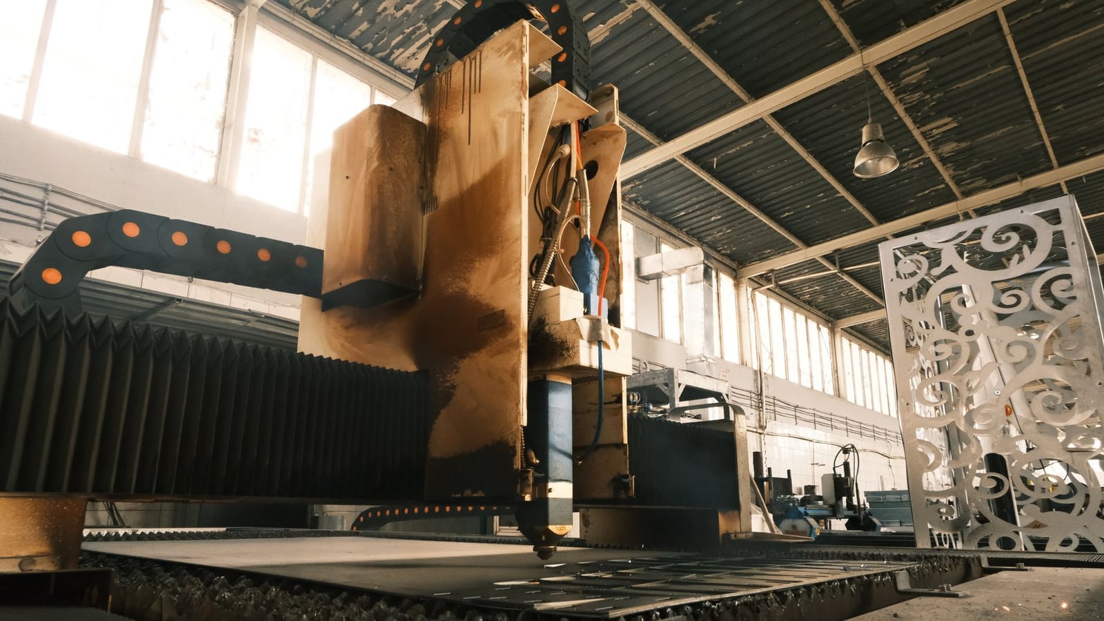 Comparison between a digital vector path and the final laser-cut result on plywood.